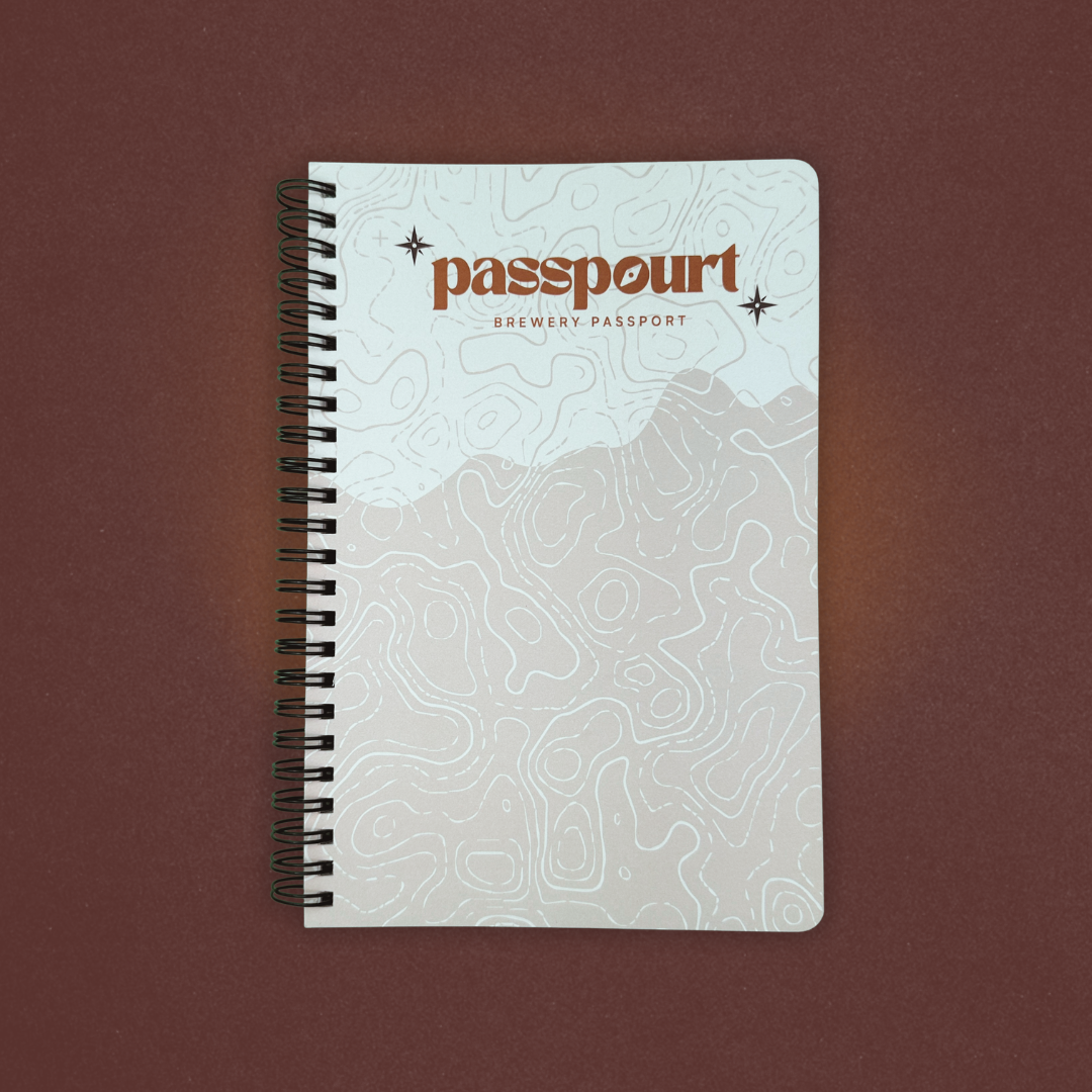 Notebook with 'passpourt' branding on a brown background