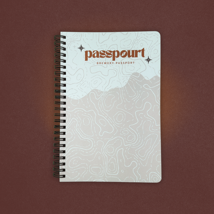 Notebook with 'passpourt' branding on a brown background